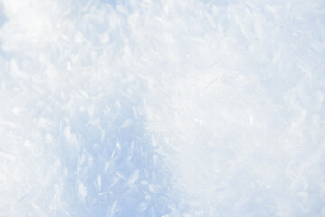 Hoarfrost background texture. Fresh ice and snow winter backdrop with snowflakes and mounds. Seasonal wallpaper. Frozen water geometrical shapes and figures. Cold weather atmospheric precipitation.