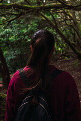 A woman walking through the forest