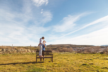 Young couple  Hugging, kissing and enjoying spending time together while celebrating Saint Valentine's Day in the countryside. Love san valentin and Relationship concept.