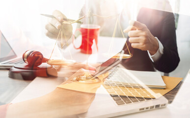 justice and law concept.Male judge in a courtroom on wooden table and Counselor or Male lawyer working in office. Legal law, advice and justice concept.