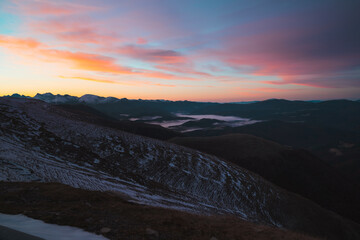 Distant cloud inversion on top of Larrau mountain pass in Pyrenees during a beautiful sunrise