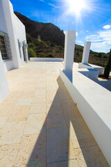 Large terrace of house with white pillars