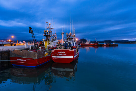 Fishing port of Santo&ntilde;a at dusk, Parque Natural de las Marismas de Santo&ntilde;a, Victoria y Joyel, Cantabria, Spain, Europe