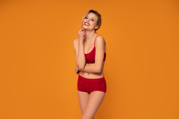 Smiling, happy blonde woman with perfect fit body.