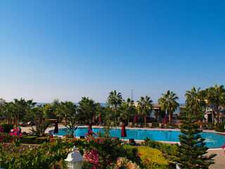 View from the top on the swimming pool, sea, trees and landscape. Turkey, Alanya.