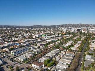 Fototapeta premium Aerial view above Mid-City neighborhood in Central Los Angeles, California. USA