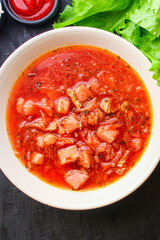 fresh borscht red tomato soup with meat first course yulion and vegetables ready to cook and eat on the table for healthy meal snack outdoor top view copy space for text food background rustic image