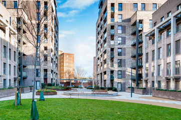 London, United Kingdom, January 04, 2021: New modern apartment block of flats on the Green Street,...