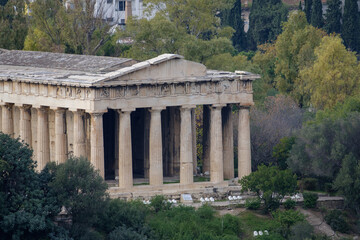 Fototapeta na wymiar Athens - December 2019: view of Temple of Hephaestus with Athens in background