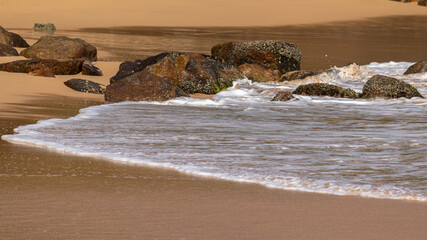 waves on the beach, washing the golden sand in the evening, empty beaches post coronavirus.