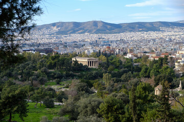 Fototapeta na wymiar Athens - December 2019: view of Temple of Hephaestus with Athens in background