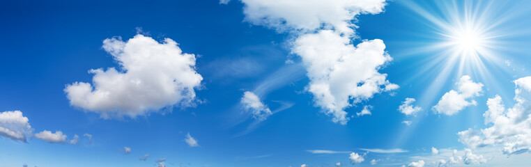 white fluffy clouds on blue sky in summer