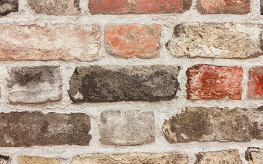 Texture of brick wall in different colors - wallpaper imitating a brick wall