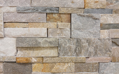 Texture - tiles for floor and wall imitating a wall of hewn uneven stone assembly of various shapes