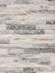 Texture - tiles for floor and wall imitating a wall of hewn uneven stone assembly