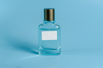 perfume bottle on blue background