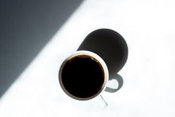 
COFFEE CUP, ON WHITE TABLE