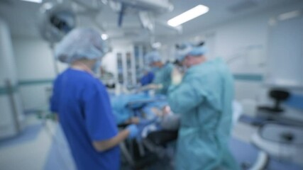 Blurred bokeh background of surgery in operating room of medical hospital clinic.