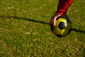 Soccer ball in a man's hand