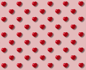 Pattern of red hearts on pink background