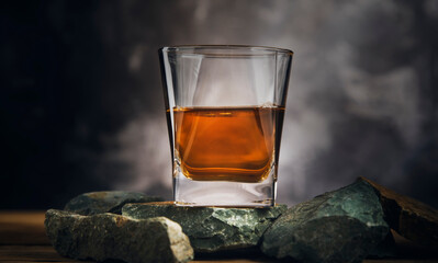 glass of whiskey on stone