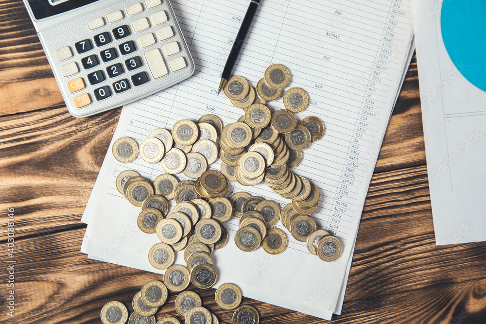 Poster coins and calculator on document