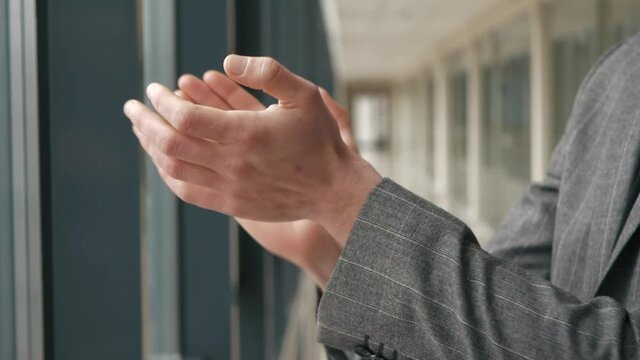 Applause. Male hands clapping indoor. Close up of success man hands applauding next to window. Claps for healthcare workers