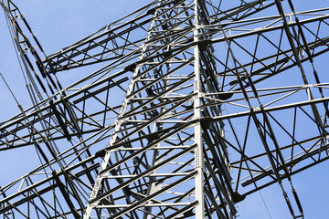  Looking up to an overhead power line. Symbol for energy, electricity, power grid.