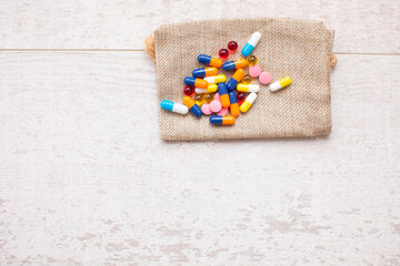 Assorted colourful pills on the table.
