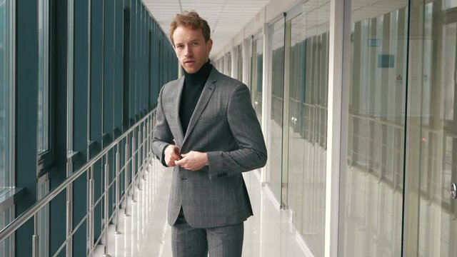 Fashion handsome man posing on camera and indicating. Successful businessman posing and pointing on camera, choosing lucky winner, indicating to you. Hey you