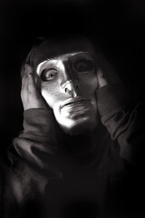 Person with a mask and wide eyes