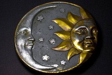 Sun, moon and stars art on black background