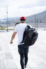 Backpack with sports clothing and accessories.