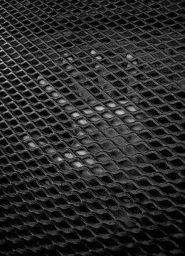 hand in metal grid background