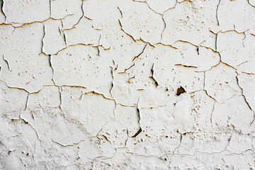 Fototapeta premium Texture of a concrete wall with cracks and scratches which can be used as a background