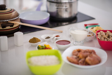 Preparing food in modern white kitchen