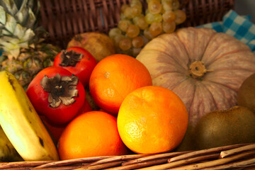 Close-up of a basket with autumn and winter fruit