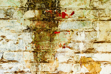 Texture of a brick wall with cracks and scratches which can be used as a background