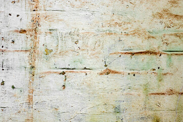 Texture of a brick wall with cracks and scratches which can be used as a background