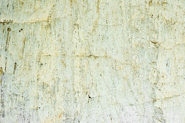 Texture of a concrete wall with cracks and scratches which can be used as a background