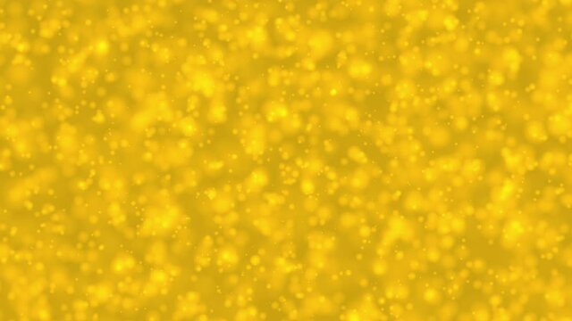 Bokeh bright yellow dreamy background with shiny glowing circle which are approaching like champagne bubble. For celebrating winter Holidays and Saint Patrick Day concept backdrop 4k with copy space