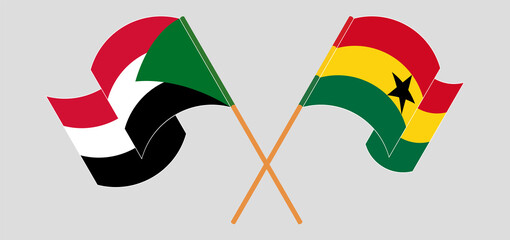 Crossed and waving flags of the Sudan and Ghana