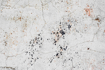 Texture of a concrete wall with cracks and scratches which can be used as a background