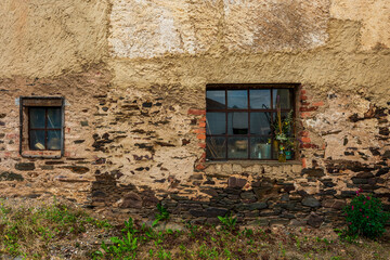 Old facade with windows and decoration.