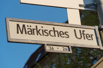 Maerkisches Ufer street name sign in Berlin. The pier Märkisches Ufer is a departure point for several river cruises through the Germany's capital city