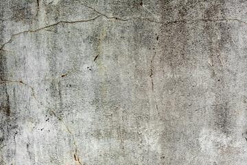Texture of a concrete wall with cracks and scratches which can be used as a background