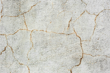 Texture of a concrete wall with cracks and scratches which can be used as a background