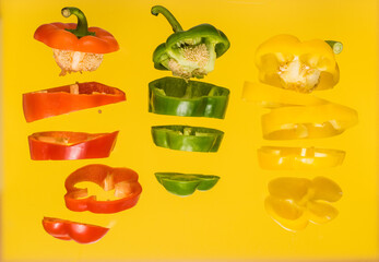 Set of vegetables of bell pepper. Vegetables are cut to pieces on white background.