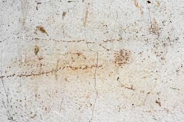 Texture of a concrete wall with cracks and scratches which can be used as a background