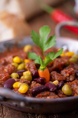 chili con carne on wood